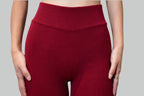 Red ribbed lounge pant worn by a person on a gray background